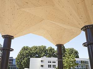 The wooden shells are supported by eight steel columns